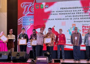 Pj. Walikota Kotamobagu Terima Penghargaan Dari Kemendagri