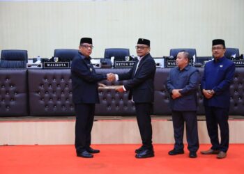 Pj. Walikota Kotamobagu Hadiri Paripurna Persetujuan Ranperda APBD 2025